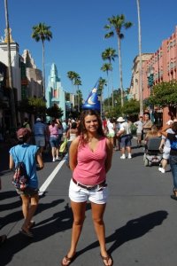 My sister "wearing" Mickey's hat!